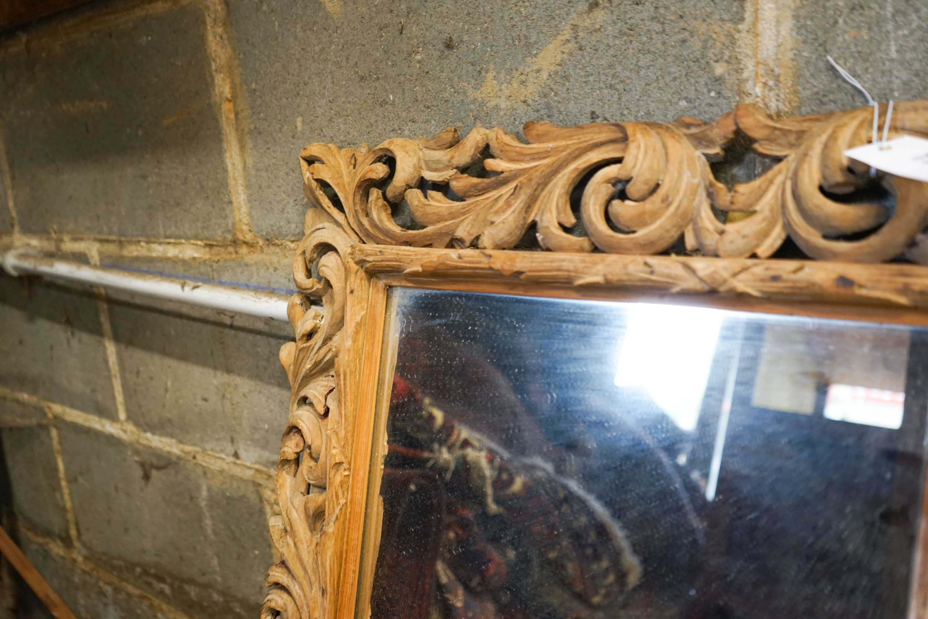 A carved oak framed rectangular wall mirror, width 65cm, height 82cm